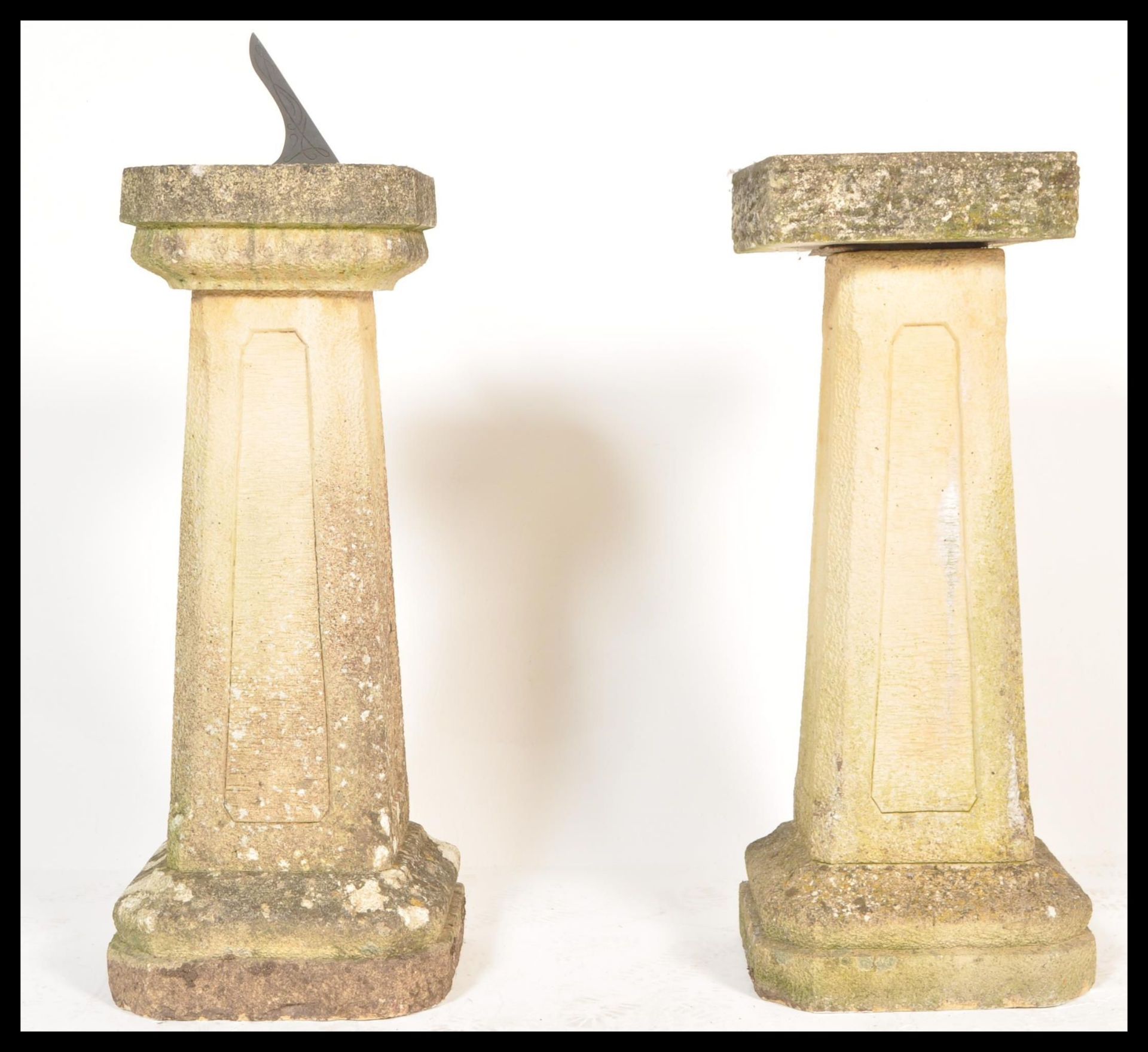 A pair of 20th Century matching well weathered garden stone sundial and bird bath raised on tall