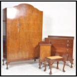 An early 20th century mahogany Queen Anne bedroom suite comprising a chest of drawers, bedside