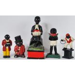 A collection of four vintage Negro style cast metal money boxes, all with hand painted finish