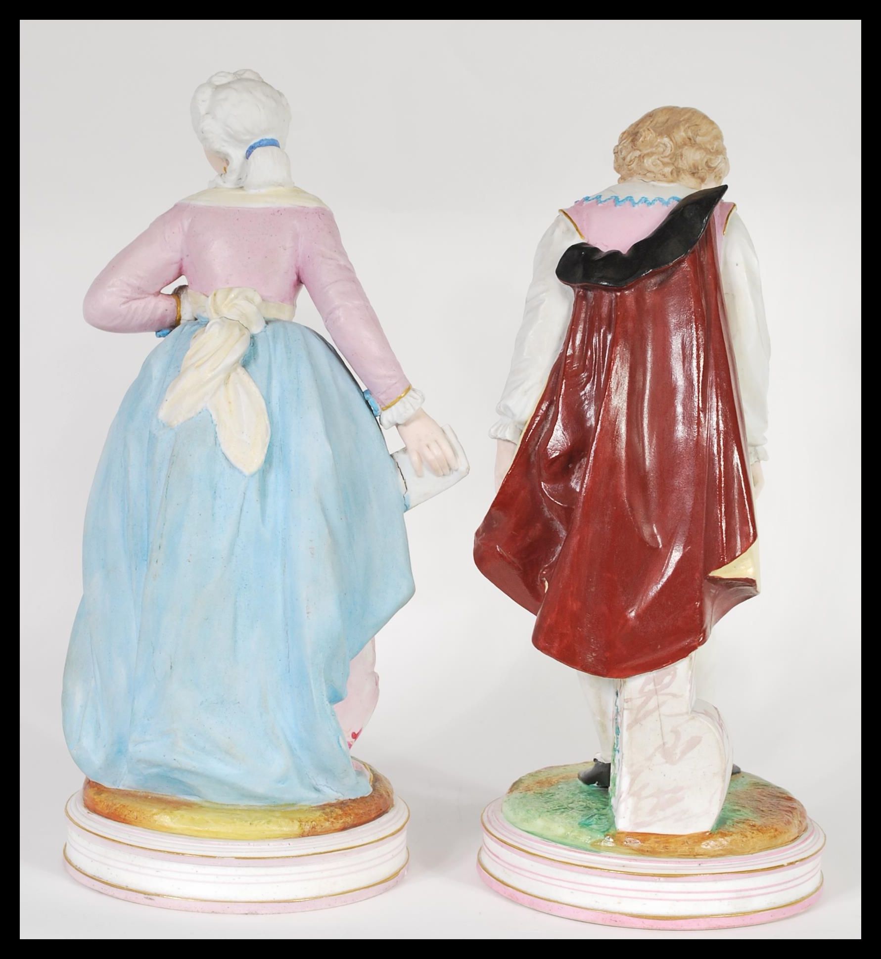 A pair of early 20th Century French Continental Bisque ware figurines depicting a courting couple. - Image 5 of 7