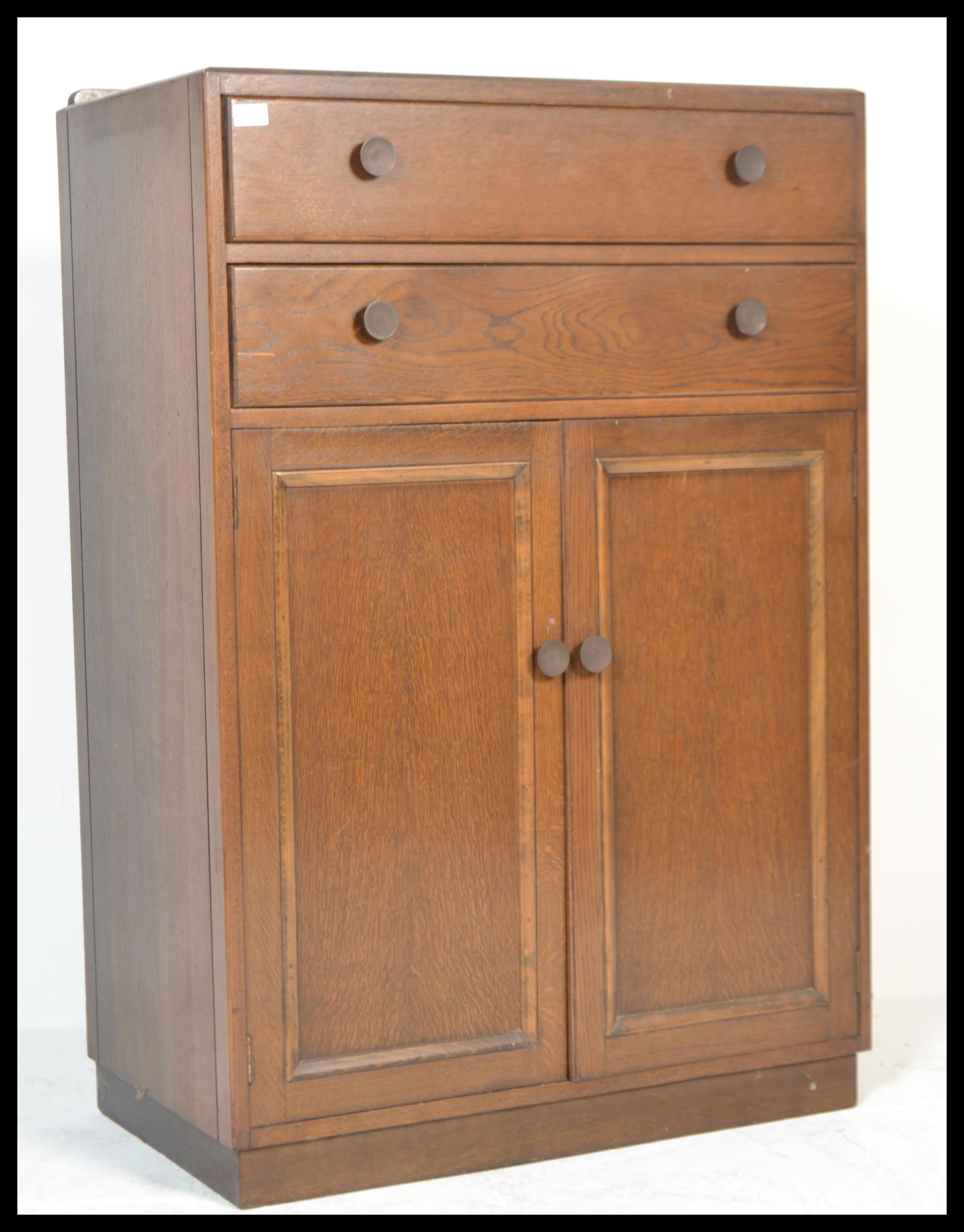 A vintage early 20th Century circa 1930's mahognay tallboy, chest cupboard two long drawers over