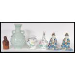 A collection of 20th Century Chinese ceramics to include republic period figures, vases, lidded