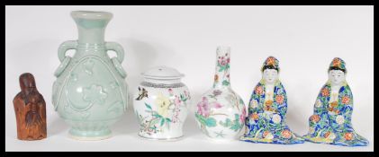 A collection of 20th Century Chinese ceramics to include republic period figures, vases, lidded