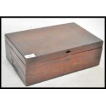 A early 19th century Georgian mahogany writing slope box. The inlaid hinged lid opening to reveal
