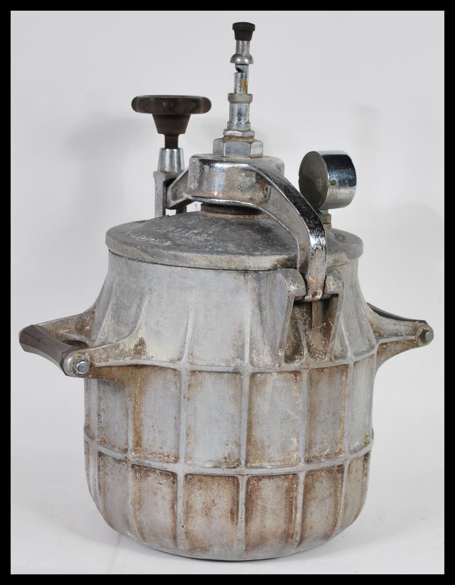 A rare vintage 1930's Easiwork pressure cooker. Ribbed iron / steel construction with pressure gauge