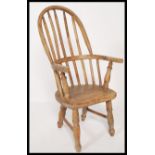 A 19th Century Victorian beech and elm Windsor hoop back childs childrens nursery chair raised on