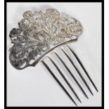 A vintage Tiffany & Co silver hair comb accessory with five prongs having a scrolled floral design