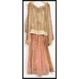 An early 20th Century revival of a dress from the middle ages, the dress with rabbit fur collar,