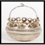 A hallmarked Russian 875 silver tea strainer in the form of a basket having stamped 84 mark.