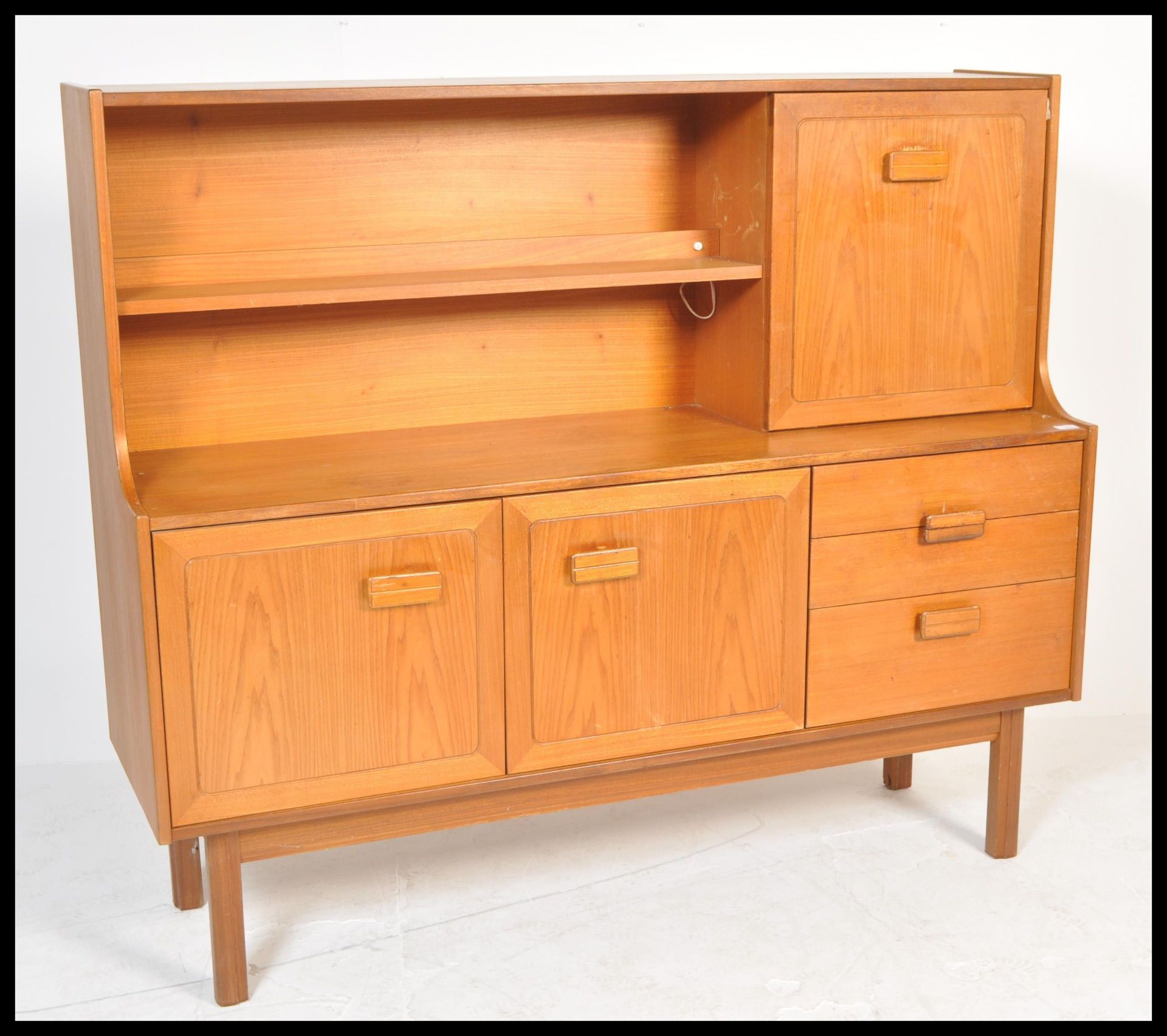 A retro 20th Century teak wood highboard sideboard credenza by Alfred Cox having an arrangement of - Image 2 of 6