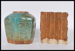 A 20th Century Chinese stoneware water pot of concertina form with brown glaze to the top and