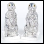 A pair of continental silver 800 stamped novelty condiments in the form of rabbits or hares raised