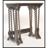 A set of early 20th Century Edwardian oak nest of three graduating side tables, solid frieze tops