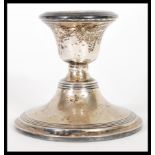 A early 20th century silver hallmarked stub filled candlestick. Birmingham assay mark dating to 1910