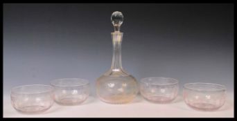 An early 20th Century Edwardian glass decanter and bowl set consisting of tall faceted glass