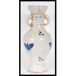 A 20th Century Chinese large vase having blue and white decoration of butterflies with twin elephant