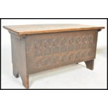 An early 19th Century oak Gothic Pugin revival chest or coffer having carved ecclesiastical  arch