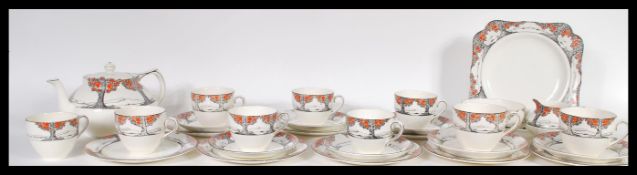 A rare Crown Ducal early 20th Century Art Deco ceramic tea service in the Orange Tree pattern