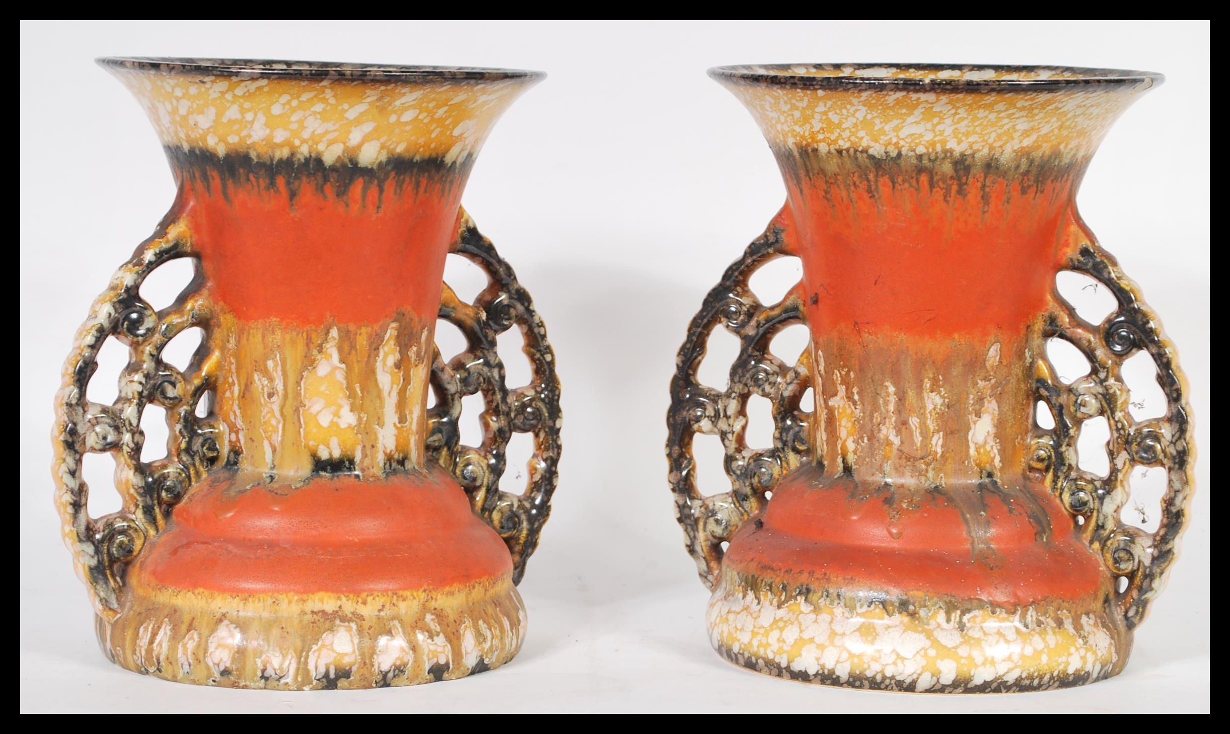 A pair of studio pottery mid century twin handled drip glaze vases in the West German Fat Lava