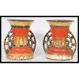 A pair of studio pottery mid century twin handled drip glaze vases in the West German Fat Lava