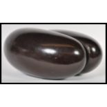 Natural History - A polished Coco de mer being dark in colour and uncarved. A large complete nut,