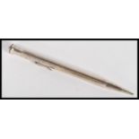 An early 20th Century sterling silver large sized Life Long propelling pencil having engine turned