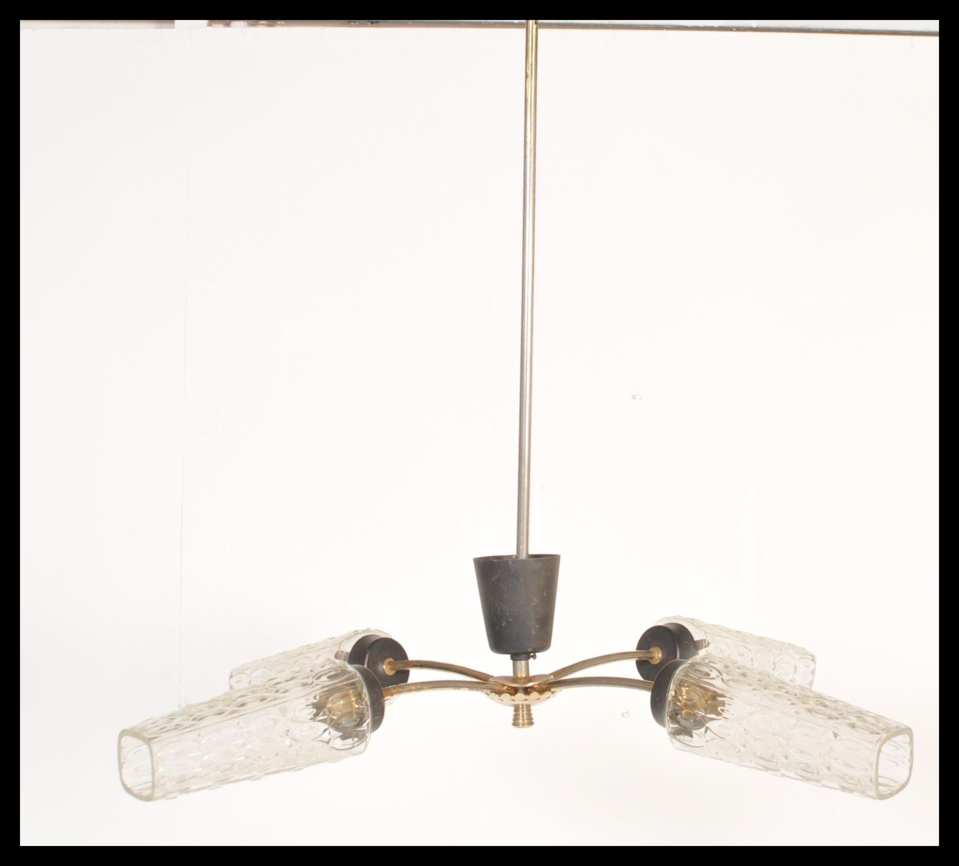 A vintage mid century retro electrolier chandelier having tubular metal form with 3 branches all