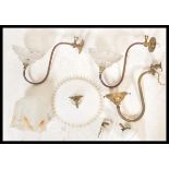 An early 20th century milk glass rise and fall chandelier light together with a pair of brass s-