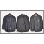 Three vintage 20th Century designer pin striped Saville Row suits by Oscar Jacobsen, all being