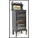 A 19th Century Victorian ebonised mahogany Art Nouveau music cabinet of pedestal form with upright