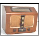 A vintage mid 20th Century 1950's oak cased HMV His Master's Voice radiogram radio having bakelite