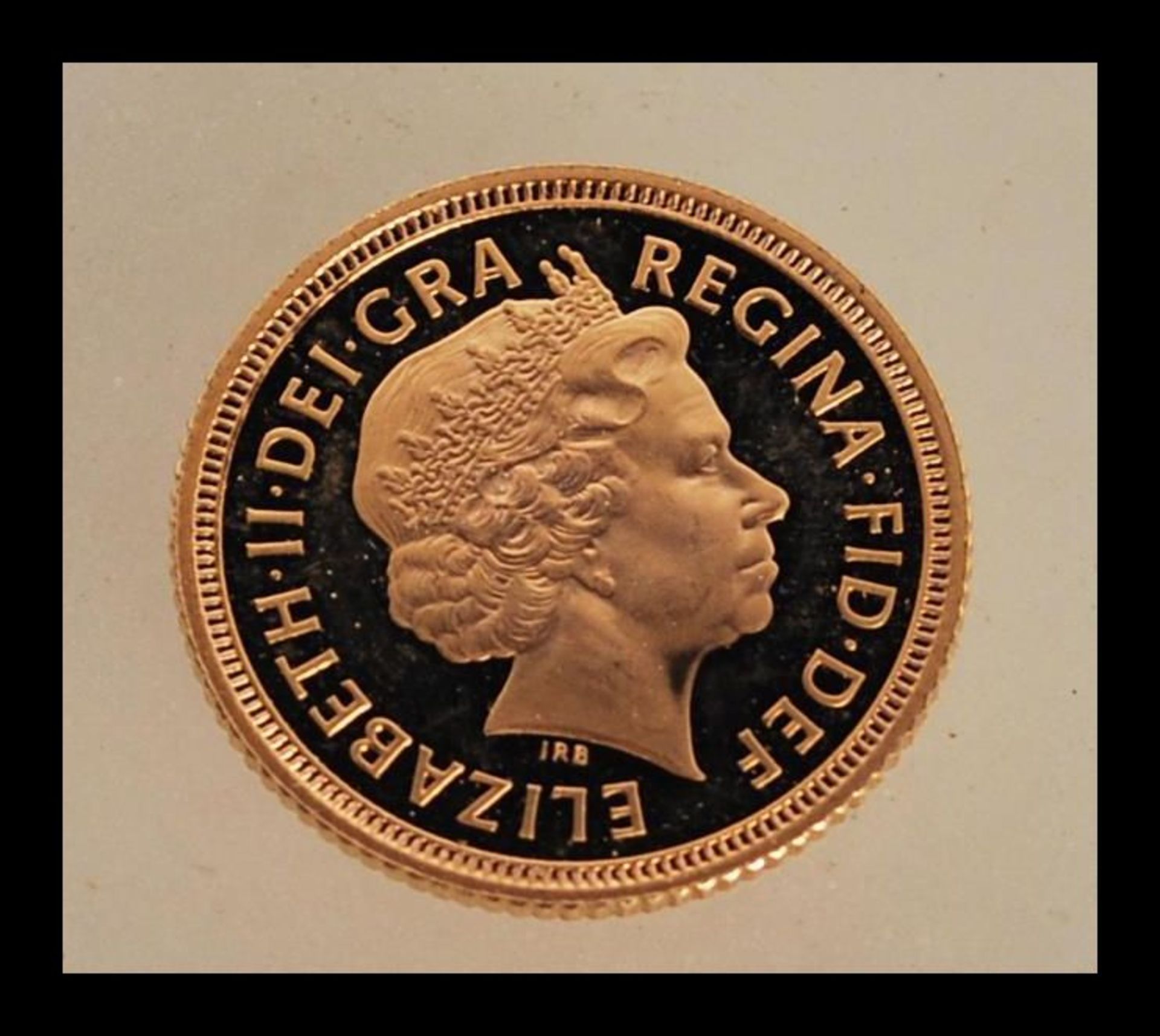 A 22ct gold half sovereign dated 1999 with George and the dragon to one side and Elizabeth II facing