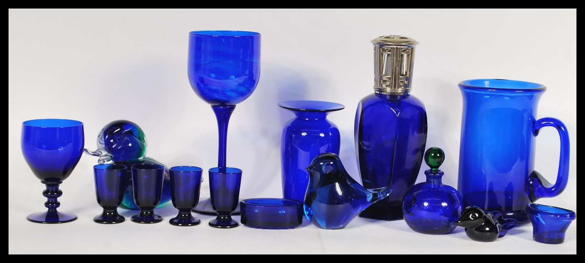 A collection of 20th Century blue glass wares to include a Bristol blue glass vase, a wine glass