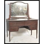 An Edwardian inlaid kneehole dressing table, swing