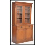 A 19th Century Victorian mahogany library bookcase, cabinet. The top half with moulded cornice above