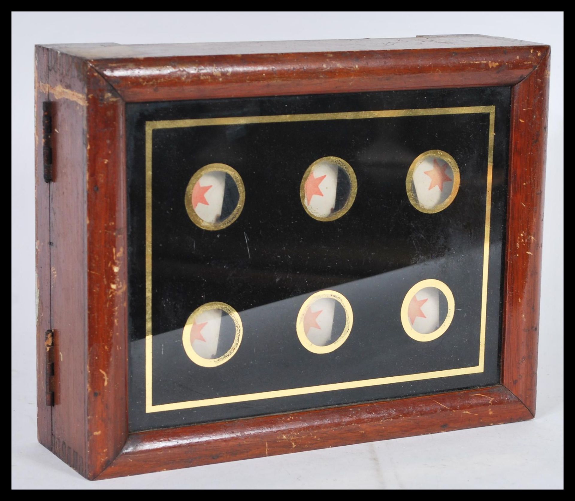 An early 20th Century Edwardian servants bell board indicator, the six bell glazed board housed