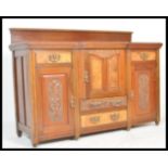 A 19th Century Victorian walnut and mahogany Art Nouveau sideboard credenza having breakfront with