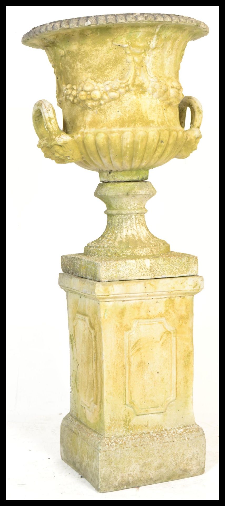 A large  20th Century well weathered stone garden planter campana  urn raised on square column