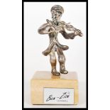 An Israeli silver stamped 925 silver figurine by Ben Zion depicting a street violinist on a wooden