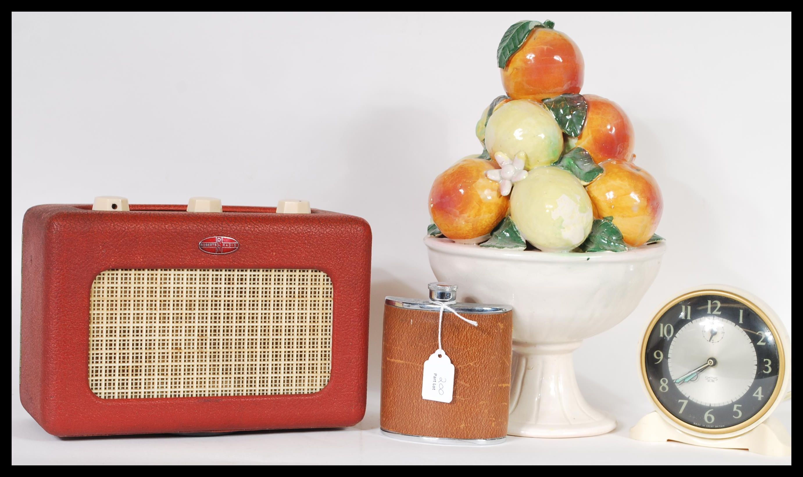 A collection of vintage and retro items to include a red vinyl Roberts radio, a Smiths alarm