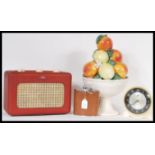 A collection of vintage and retro items to include a red vinyl Roberts radio, a Smiths alarm