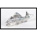 A sterling silver vesta case in the form of a fish having hinged lid to head. Weighs 50 grams.