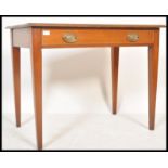 An early 19th Century Georgian mahogany writing table desk raised on square tapered legs with single