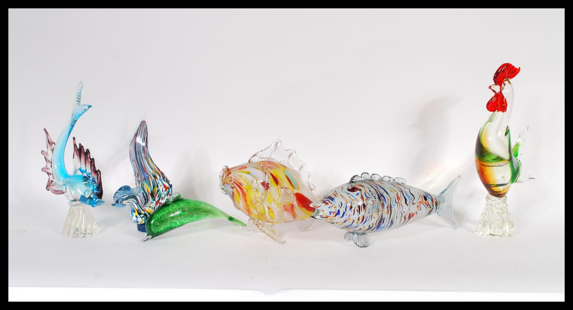 A collection of retro 20th Century Murano studio glass to include fish one in an orange colourway,