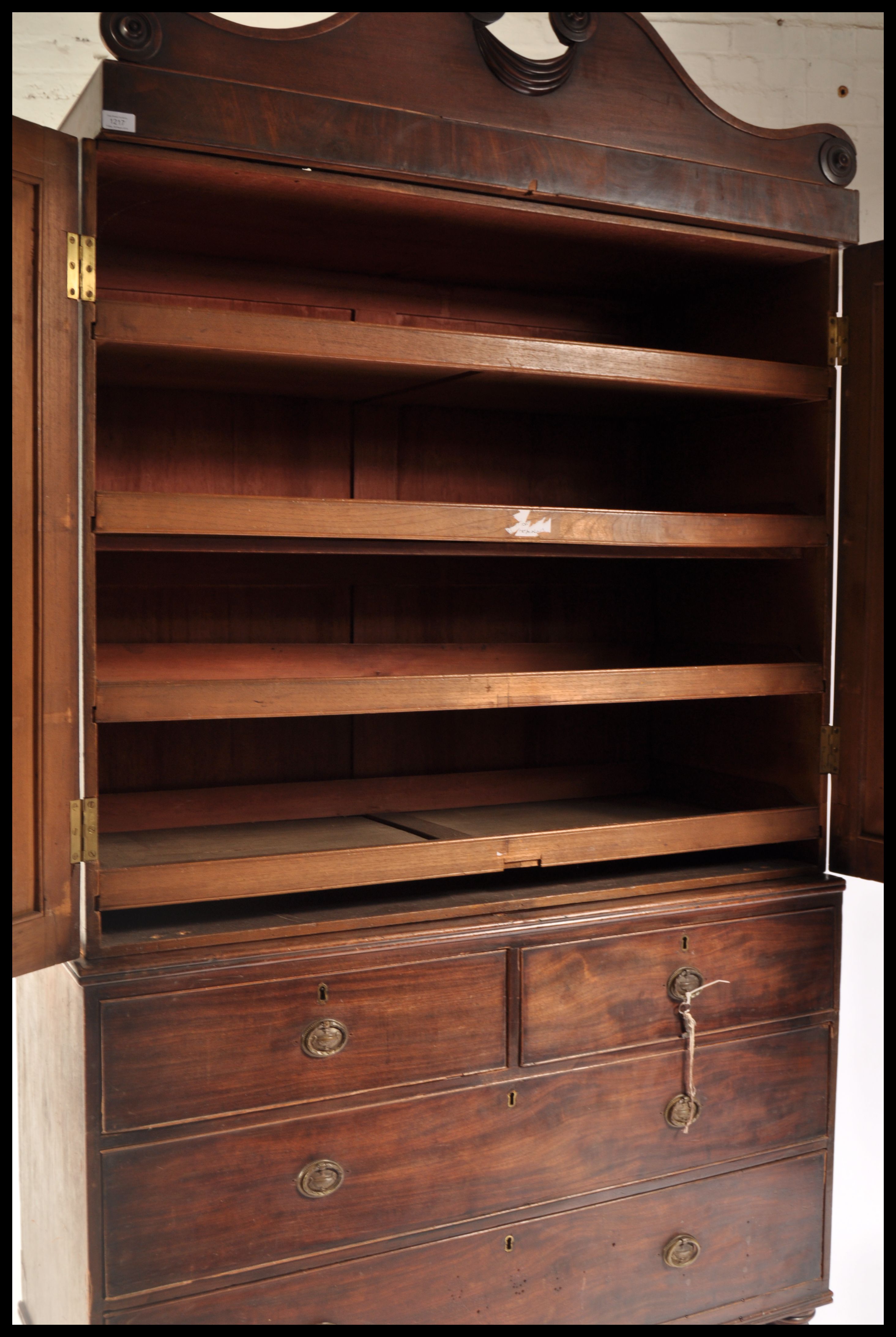 A 19th Century Regency mahogany linen press raised on a two over two chest base with twin cupboard - Image 5 of 7