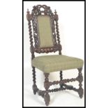 A 19th Century Victorian ebonised Carolean revival barley twist bedroom chair raised on block and