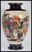 An early 20th Century Japanese Late Meiji period large Satsuma ware vase of Meiping shape having
