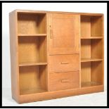 An early 20th century Cotswold school believed Heals of London library bookcase cabinet having