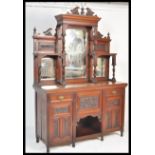 A large Victorian mahogany mirror back sideboard. The base raised on turned legs with a series of