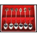 A set of six cased Sri Lanka silver teaspoons, each having a Ruby coloured stone in a claw